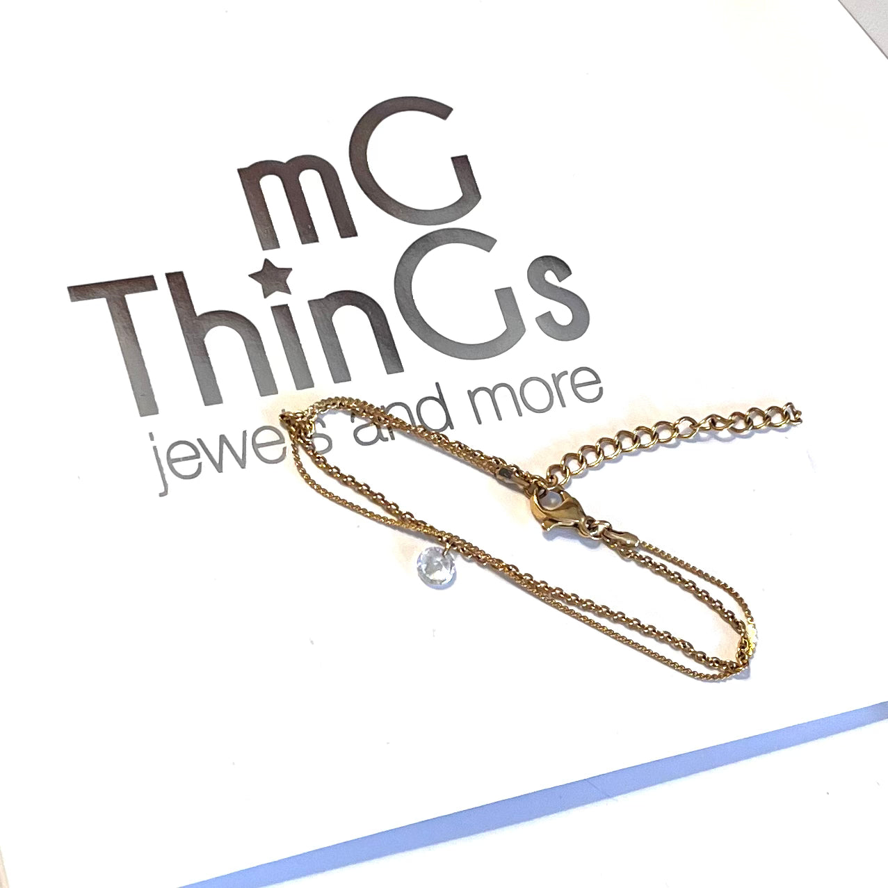 Pulsera de acero con baño de oro waterproof,doble con circonita colgante.