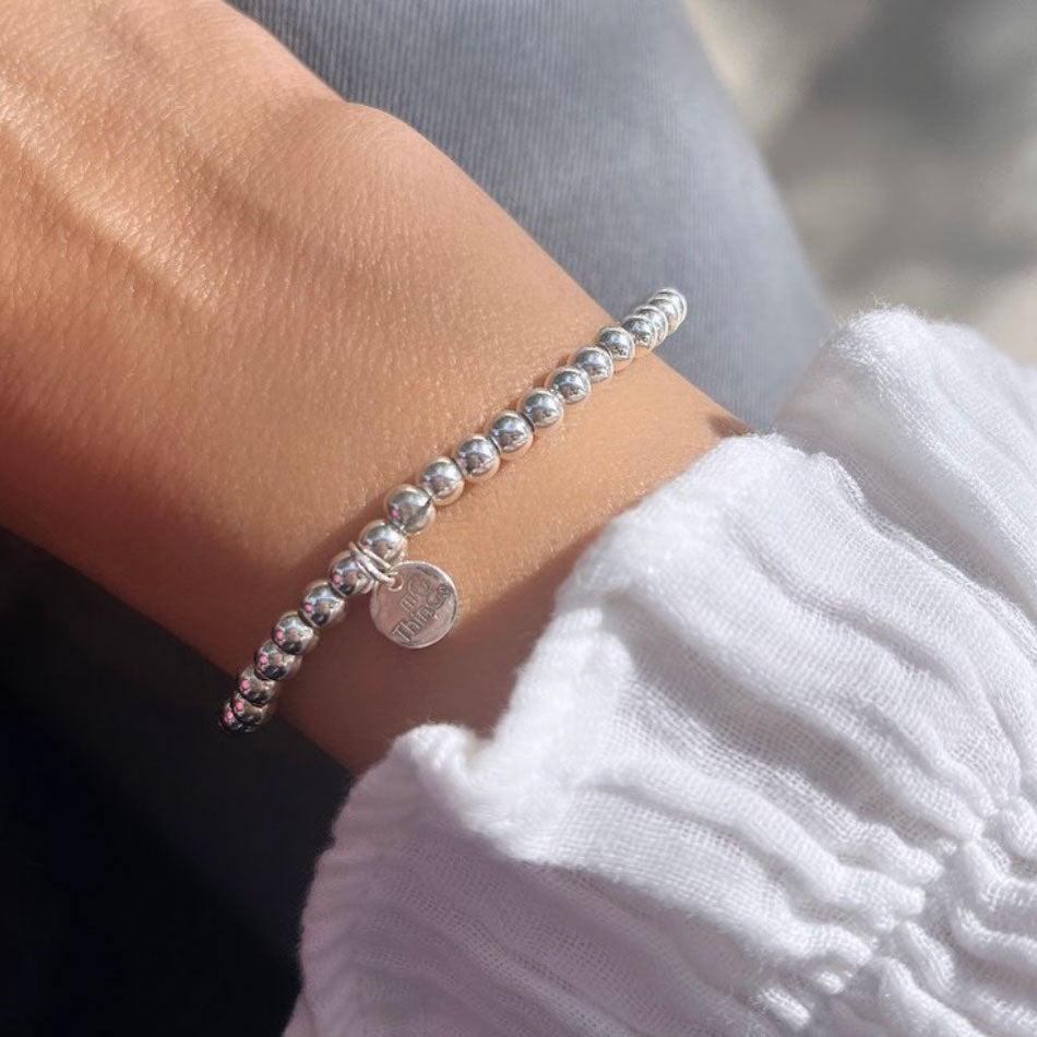 Pulsera elástica de bolitas de plata de 4mm.